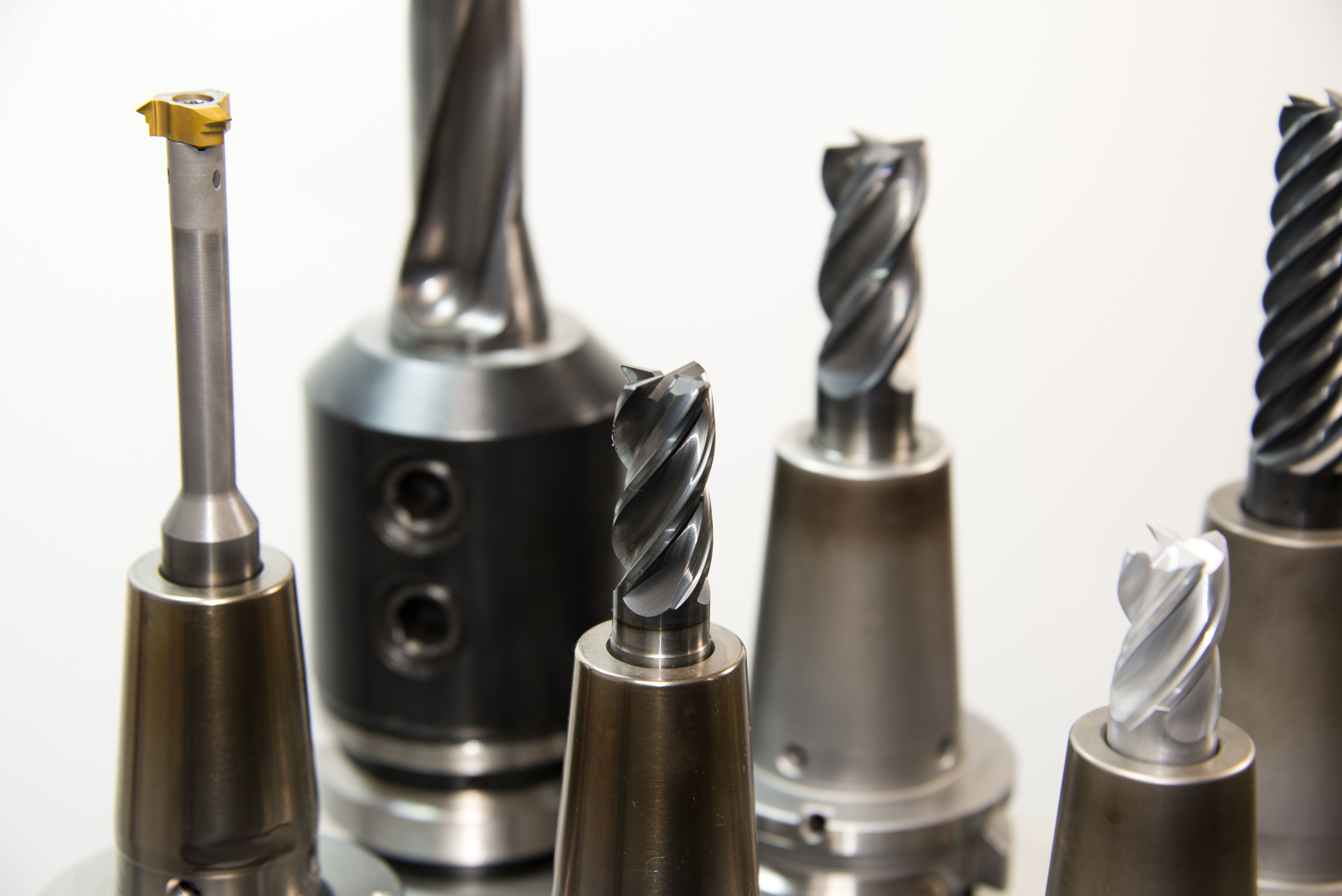 Various hand tools including wrenches, pliers, and screwdrivers arranged on a workbench